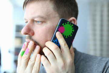 Man call smartphone with coronavirus symbol covid 19 portrait . How to protect yourself antivirus...