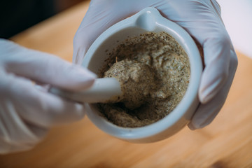 DIY Cream at Home - Grinding Herbs and Flowers Using Mortar and Pestle. Homemade Cosmetic Cream Preparation