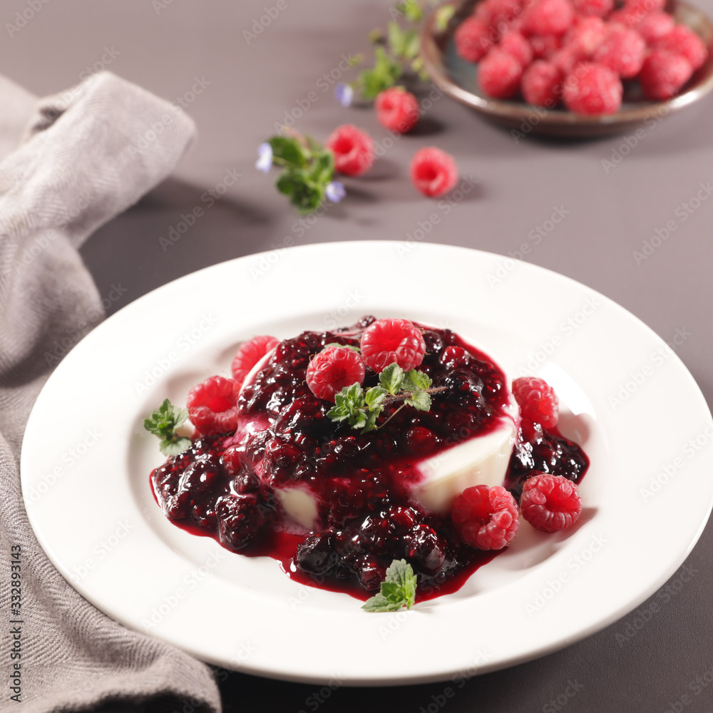 Poster panna cotta with berry fruit in plate