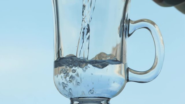 Pouring water and droping effervescent tablet in glass video