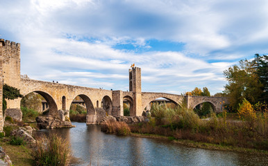 Fototapeta na wymiar Panoramic landscape of Medieval village and castle in Besalu, Costa Brava, Spain. Besalu is a famous tourist destination in Spain, South Europe. Nice place for tourism near Mediterranean Sea