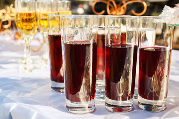 Red and yellow juice in tall glasses