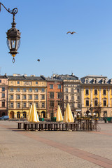 Fototapeta premium Main Market Square, a deserted city due to the coronavirus epidemic, no tourists, closed restaurants and shops, Krakow; Poland