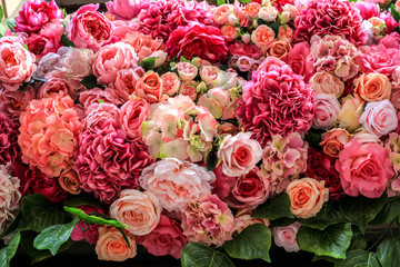 Artificial colorful different flowers background