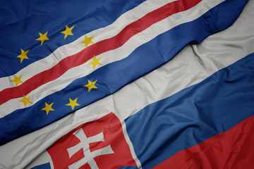 waving colorful flag of slovakia and national flag of cape verde.