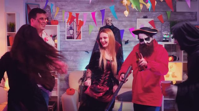 Bearded pirate with axe and his friends dancing
