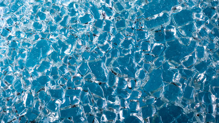 Blue texture of molten ice. Background from ice