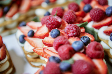 ripe strawberries bright raspberries and blueberries
