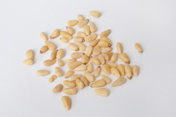 Pine nuts against a white background