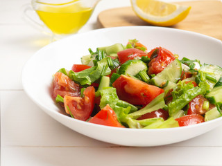 Salad of tomatoes, cucumbers and herbs. Healthy food, vegan, vegetarian.