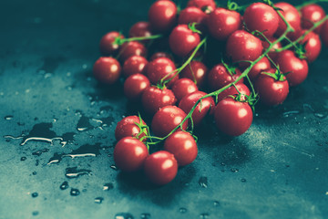 Fresh grape tomatoes as cooking ingredients top view with copyspace