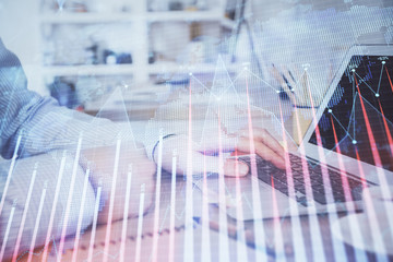 Multi exposure of stock market chart with man working on computer on background. Concept of financial analysis.