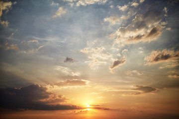 Fototapeta premium Picturesque sky with blue clouds at golden sunset