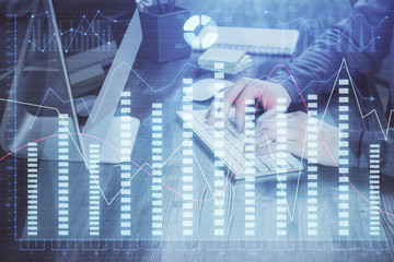 Double exposure of financial graph with man works in office on background. Concept of analysis.
