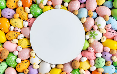 Creative layout made with colorful  Easter eggs. Minimal Easter background. Spring holidays concept.