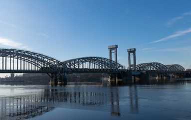 Fototapeta na wymiar St. Petersburg - March 18, 2020: Railway bridge over the Neva river. Zheleznodorozhny Bridge 