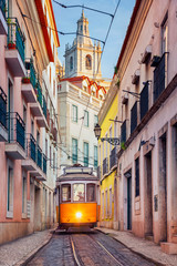 Lisbon, Portugal. Cityscape image of street of Lisbon, Portugal with yellow tram. - obrazy, fototapety, plakaty