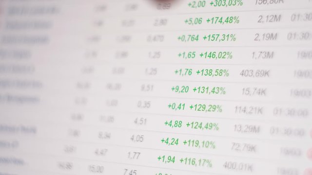 Brokers analysts point their finger at the screen Graph of crypto currency online. Quotes of eth and btc at stock exchange. Stock exchange market chart of ethereum. app on the screen of laptop or pc.