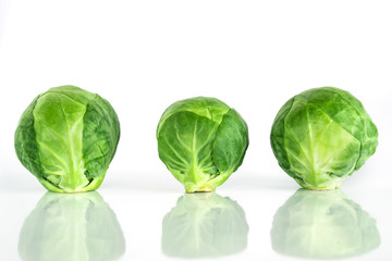 The Fresh green brussel sprouts vegetable on white background