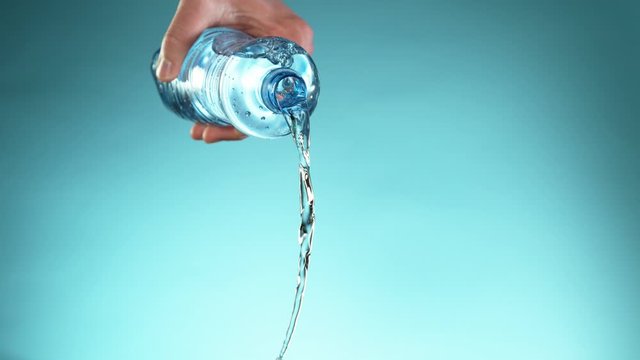 Super slow motion of splashing water from bottle. Filmed on very high speed camera, 1000 fps.