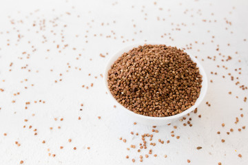  buckwheat in a plate on a white background