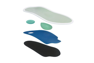Obraz premium Isolated orthopedic insole on a white background. Treatment and prevention of flat feet and foot diseases. Foot care, comfort for the feet. Wear comfortable shoes. Medical insoles.
