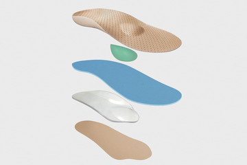 Isolated orthopedic insole on a white background. Treatment and prevention of flat feet and foot diseases. Foot care, comfort for the feet. Wear comfortable shoes. Medical insoles.