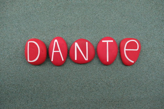 Dante, male given name composed with red colored stone letters over green sand