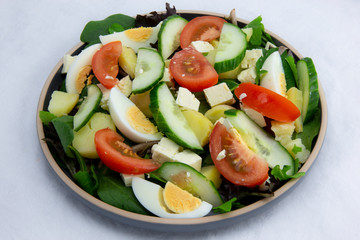 Egg, Feta, and some vegetable salad like cucumber, tomato and potato