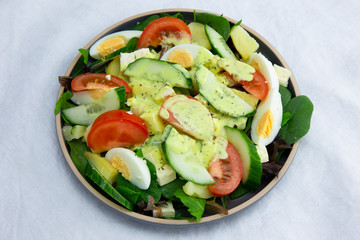 Egg, Feta, and some vegetable salad like cucumber, tomato and potato