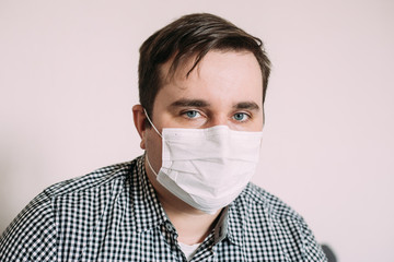 Man in facial hygienic mask