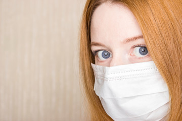 Close up horizontal image woman wear facial medical or surgical mask. Photo banner for website header design. COVID-19 protection at pandemic infectious disease outbreak.