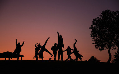 Fototapeta na wymiar silhouettes of people on a sunset