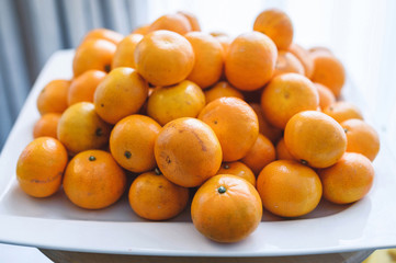 plate with fresh mandarins