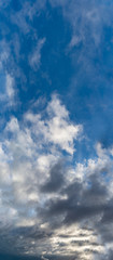 Fantastic clouds against blue sky, panorama