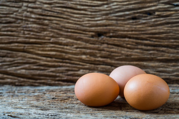 chicken eggs on wood background.selective focus