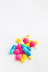 Close up multi color drug and capsules on white background.