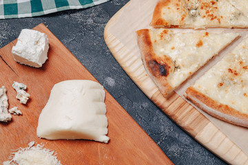 delicious Neapolitan pizza with cheese. four kinds of cheese. concept of delicious italian pizza.