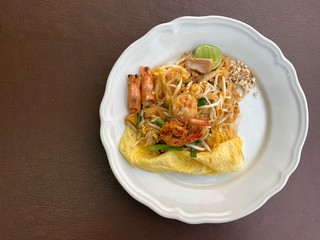 Stir fried noodle pad thai chicken very popular in sydney good with lemons