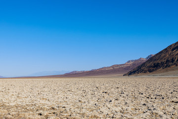 View of the Basins salt flats, Badwater Basin, Death Valley, Inyo County, salt Badwater formations in Death Valley National Park. California, USA