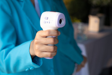 Nurse scan measure the fever by infraled thermometer protect covid-19 contagious disease. Isometric Medical Infrared Thermometer Temperature Measurement Device. Health care concept