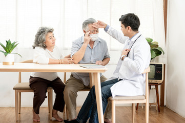 Asian elderly couples are sick doctor to check their symptoms at home. Health care , life style, pharmacy, medical, elder insurance after retire concept.
