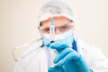 caucasian doctor with syringe