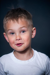 portrait of a boy with surprise on his face
