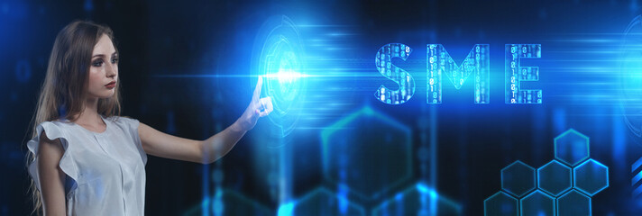 Business, Technology, Internet and network concept. Young businessman working on a virtual screen of the future and sees the inscription: SME