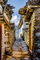 Old traditional nepalese Thinigaun (Thinigaon) village street against Mt. Dhailagiri. Kali Gandaki...