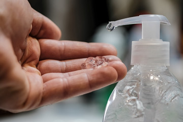 Man disinfecting with hand sanitizer dispenser,corona virus infection disease