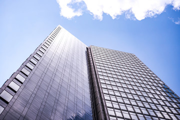 underside panoramic and perspective view to steel blue glass high rise building skyscrapers, business concept of successful industrial architecture