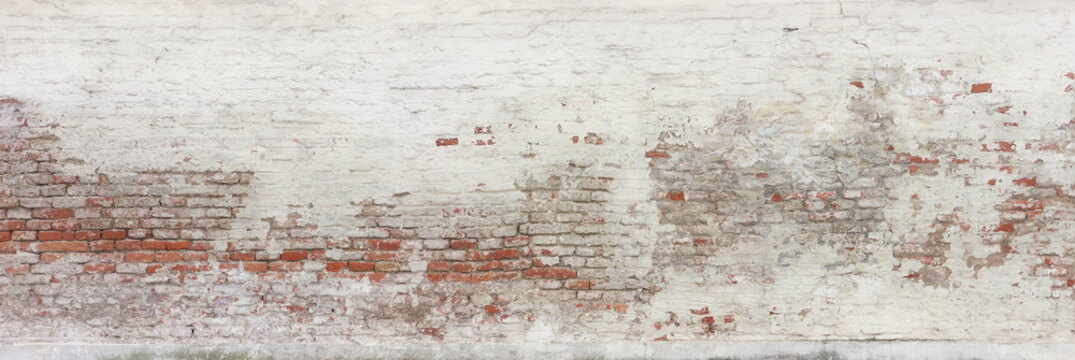 Detail of an old dilapidated farmhouse facade.