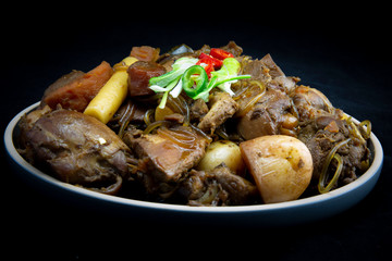Korean chicken stew with soy sauce, glass noodle, rice cake and vegetables